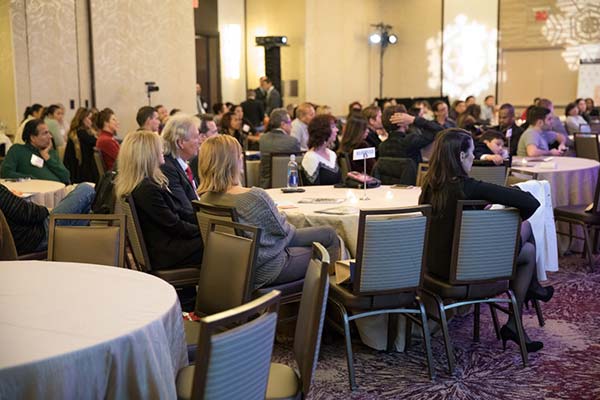 Attendees engaged in Aesthetic Talks